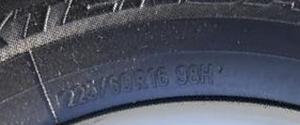 Enlarged actual tire sidewall showing 225/60R16 98H.